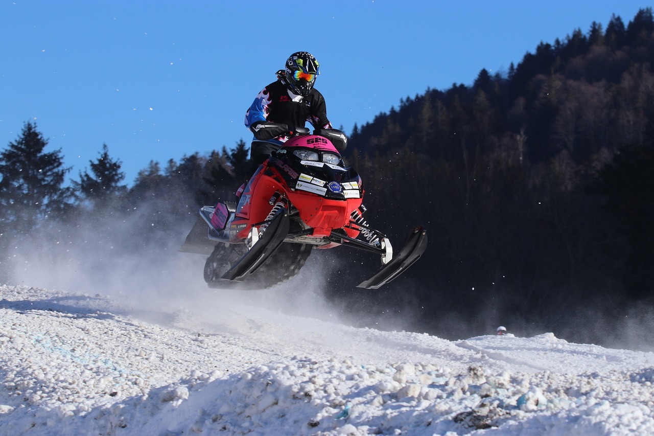 A man on a snowmobile in Mountain Village